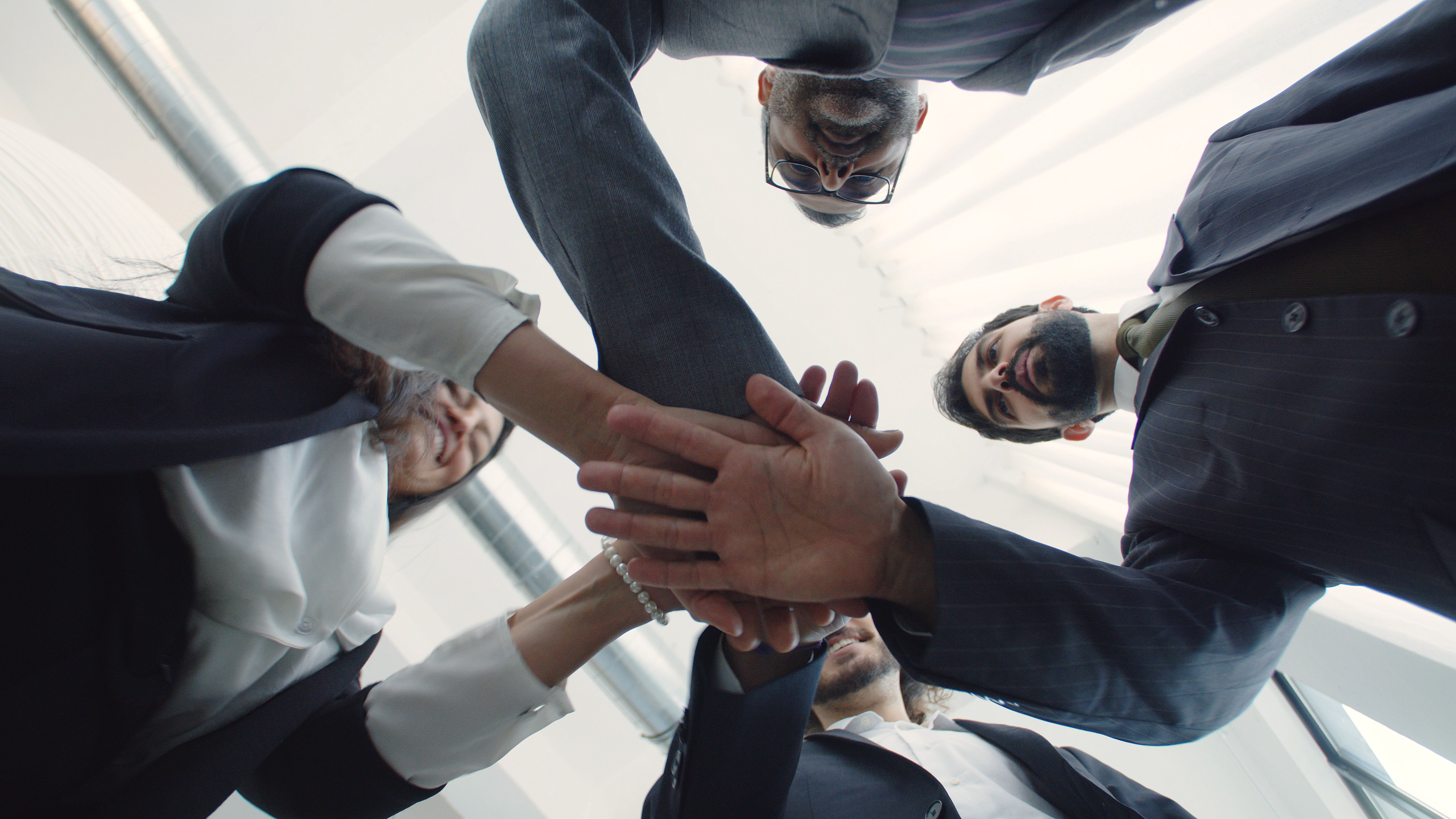 Trove-AI partner team joining hands, collaborative partnership